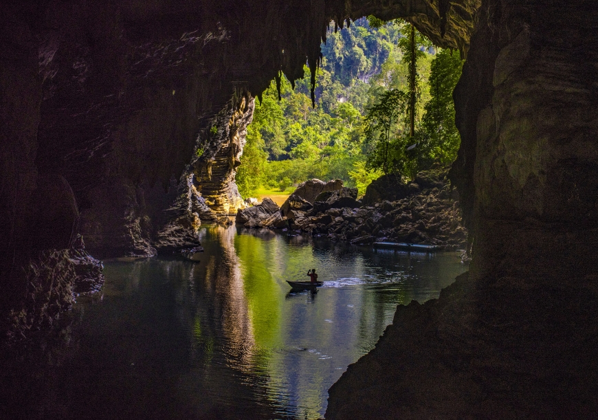 Water and limestone formations inside the Tu Lan cave system